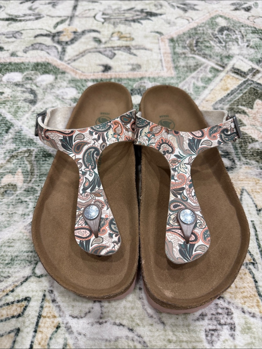 Birkenstock Paisley T-Strap Sandals in Cream, Brown, and Coral
